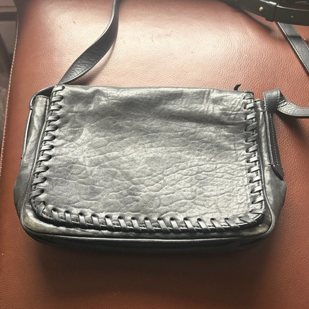 Mossimo Dutti Leather black leather crossbody bag with a braided trim.